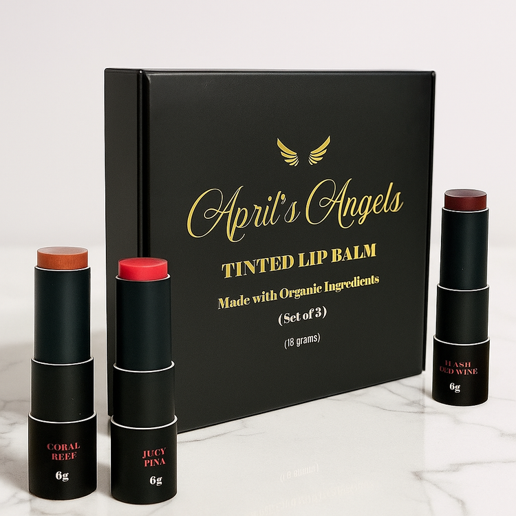 3 Different shades of tinted lip balms formulated with organic ingredients in black and gold eco-friendly packaging with April's Angels golden logo.